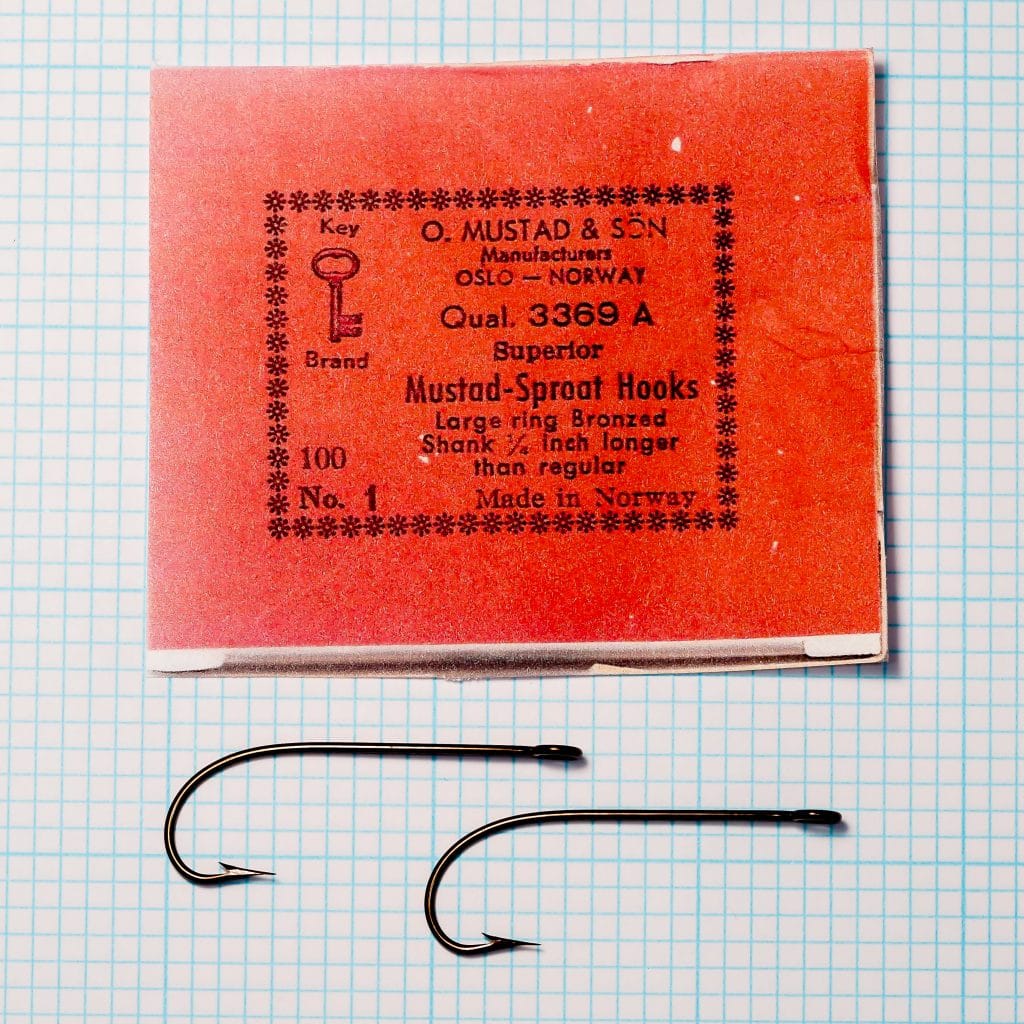 Red Mustad Qual. 3369 A packet with two loose No. 1 Sproat hooks.