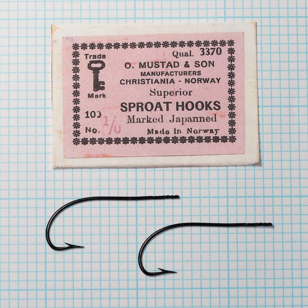 Mustad Qual. 3370 Sproat Hook — packaging label and two specimens on measurement grid — size 1/0 — Christiania era