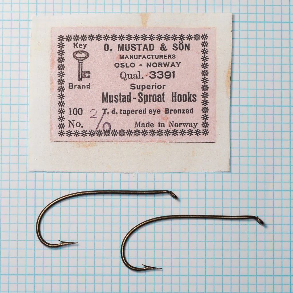 Mustad 3391 Sproat Hook — original packet with label, two hooks visible on grid, asterisk border design — size 2/0 — Oslo Norway marking