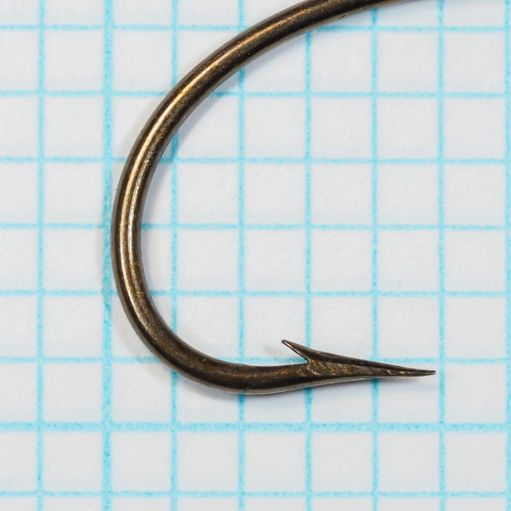 Mustad 3391 Sproat Hook — close-up of point and barb detail — size 2/0 — bronzed finish showing superior point geometry