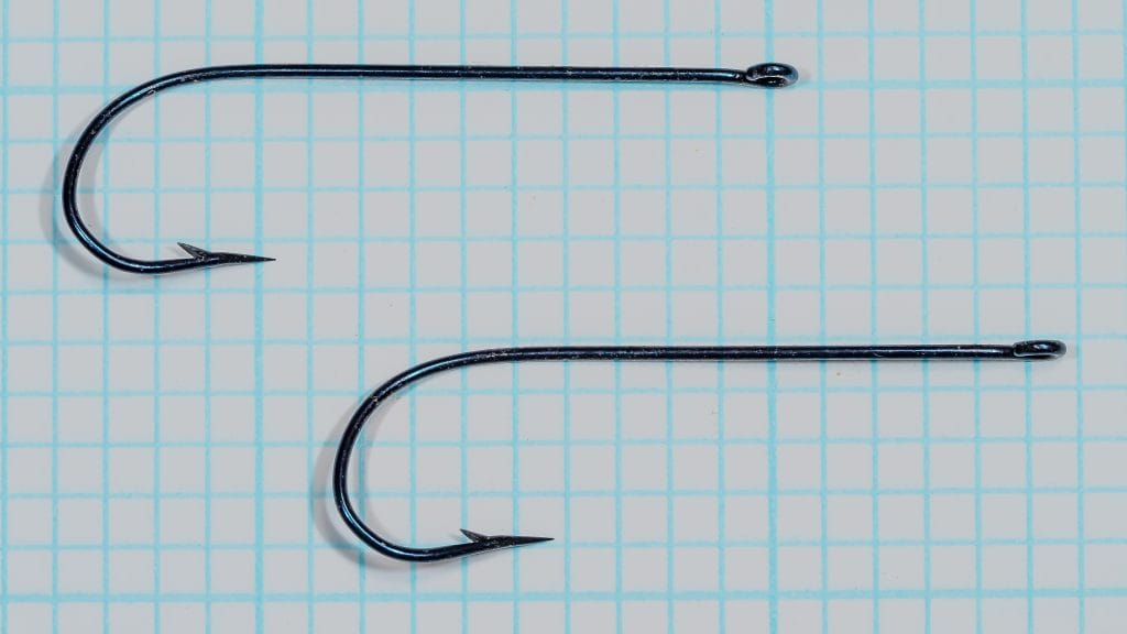 Harrison's 2996 fishhooks — two specimen Kirby bend wet fly hooks side view showing overall profile, blued finish, hollow point, and ringed eye, size 1 (100 No.), on measurement grid