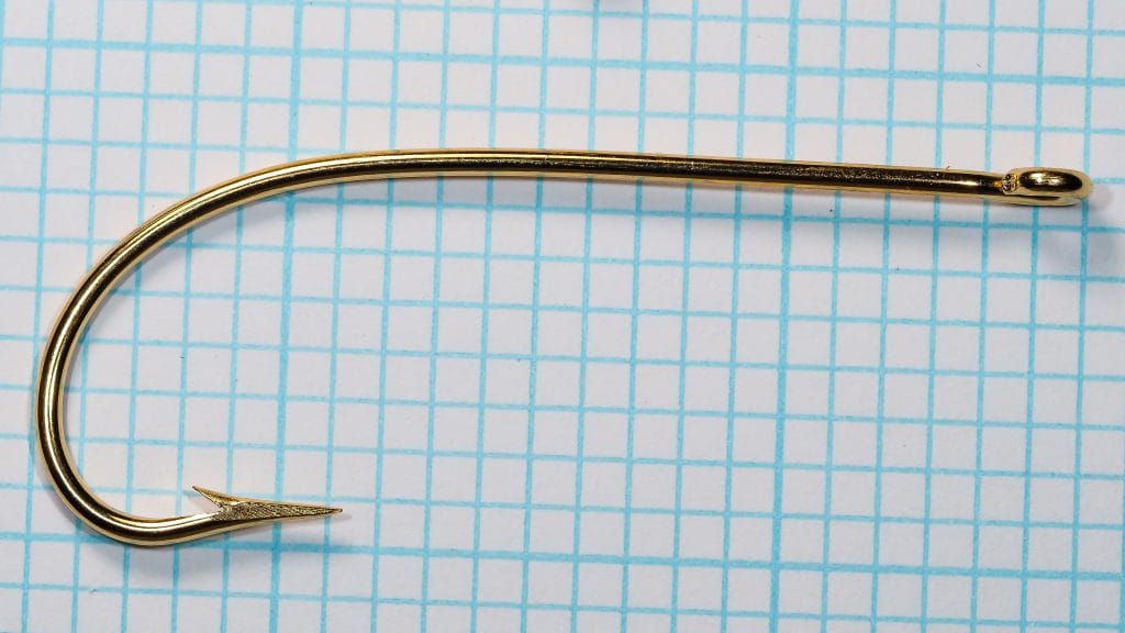 Mustad 33602 hook — side profile showing overall form — size 3/0 — ringed eye and gold plating