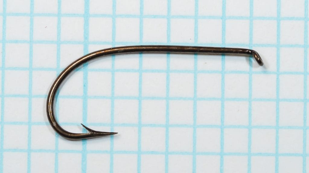Harrison Bartleet's Chathundeley Sproat No. 7 — full hook profile on measurement grid — bronzed finish — showing overall length, shank, eye, and bend geometry