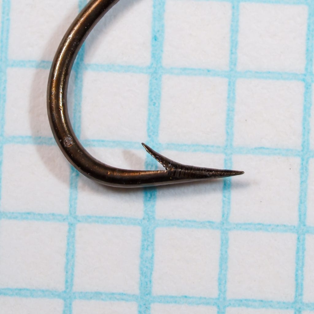 Harrison Bartleet's Chathundeley Sproat No. 7 — close-up of hook bend and point profile — bronzed finish — showing hollow point geometry and sproat bend radius