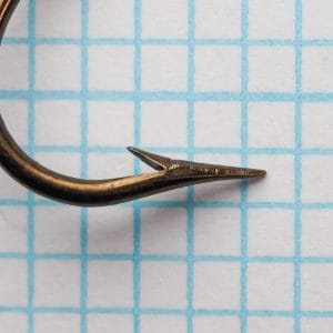 Mustad 3310 size 23 point and barb detail showing a long ground point and small barb.