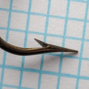 Mustad Quality 3310 — shank profile and marked ridges showing blind eye termination — size 19 — bronzed finish