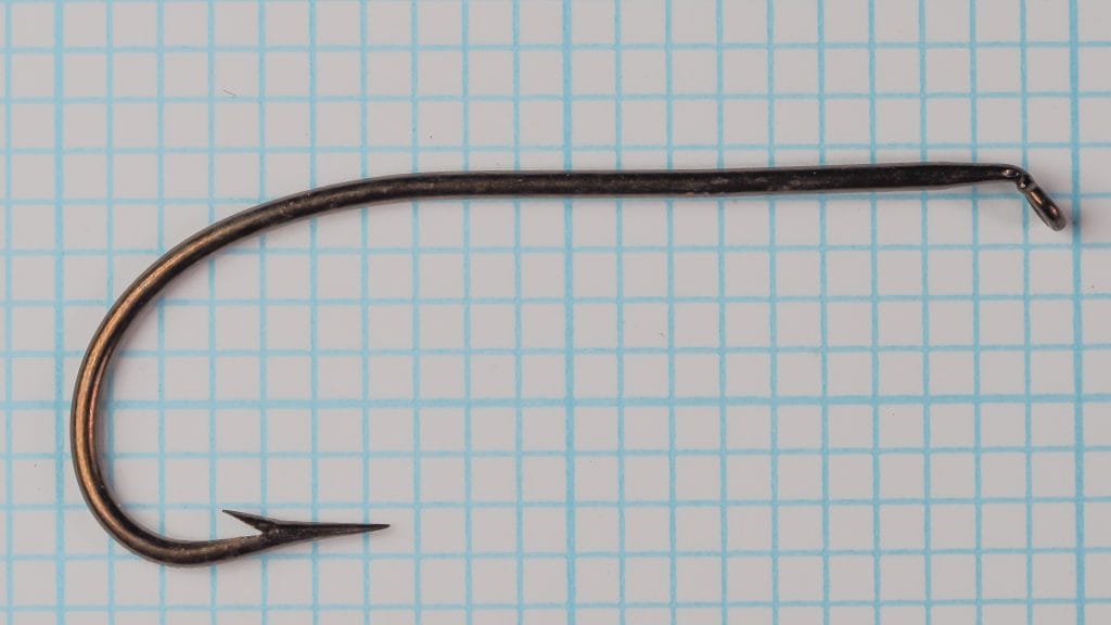 Mustad 3391 Hook — full side profile on grid — shows shank, bend, eye, and point in single view — size 2/0