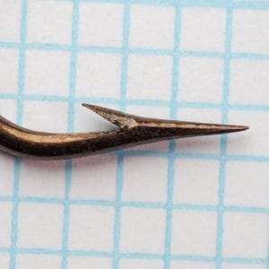 Mustad 3391 Sproat hook detail view showing eye, shank, and needle-sharp point in profile.