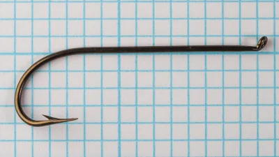 Mustad 3913 A Sproat Hook — full side profile — size 3 — showing bend, eye, and shank proportions on measurement grid