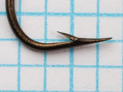 Mustad 3926 Kinsey Hook — close-up of hook point and barb geometry — size 14 — showing concave hollow-point cut and sharp barb