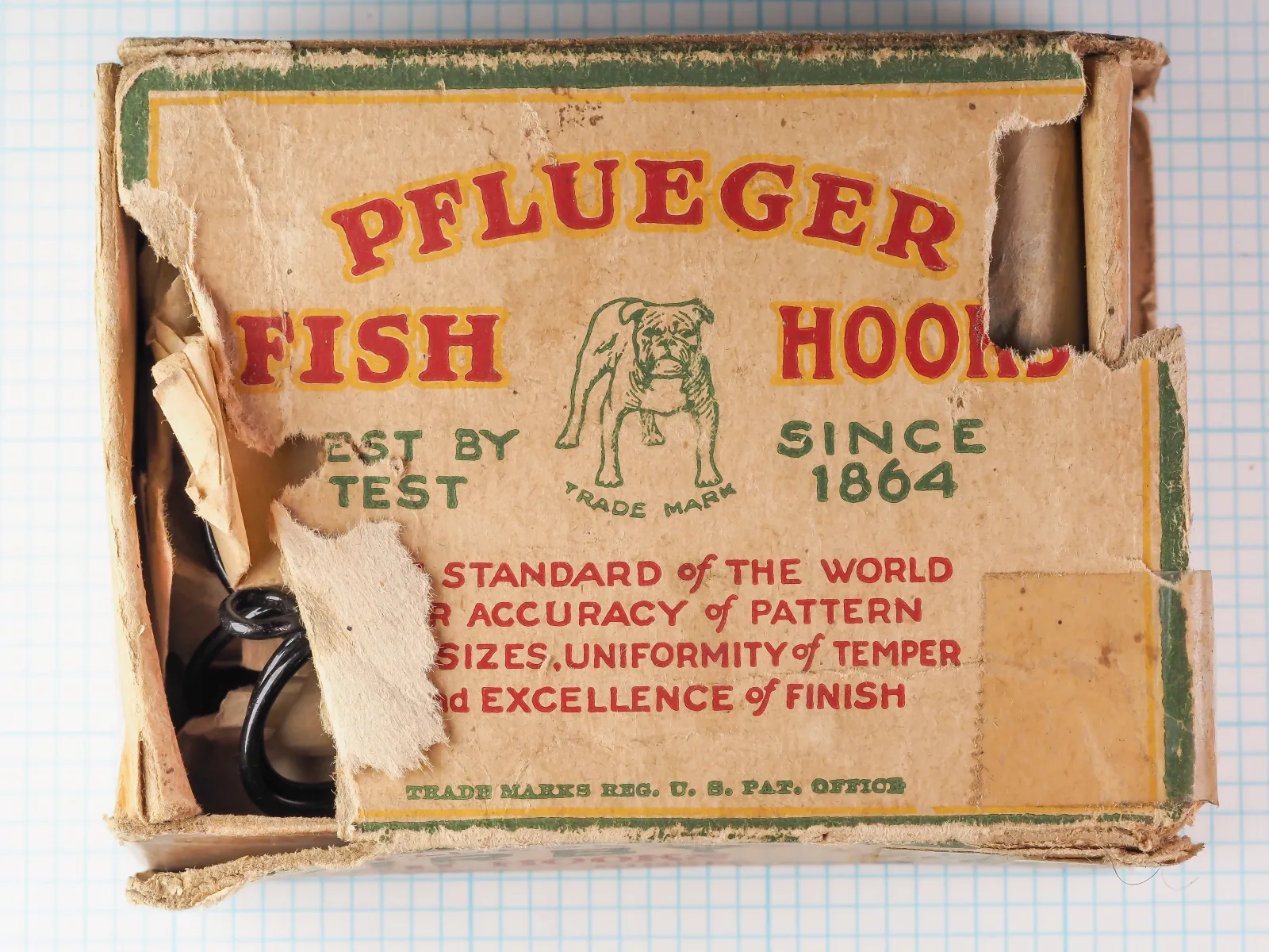 Pflueger 3221-J Kirby — original manufacturer box exterior showing front panel with red and green letterpress printing — size 6/0 japanned hooks — bulldog trademark
