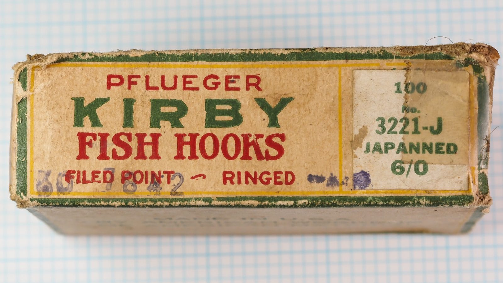 Pflueger 3221-J — box side panel showing hand-applied size label and product code in green ink — size 6/0 japanned ringed bait hooks