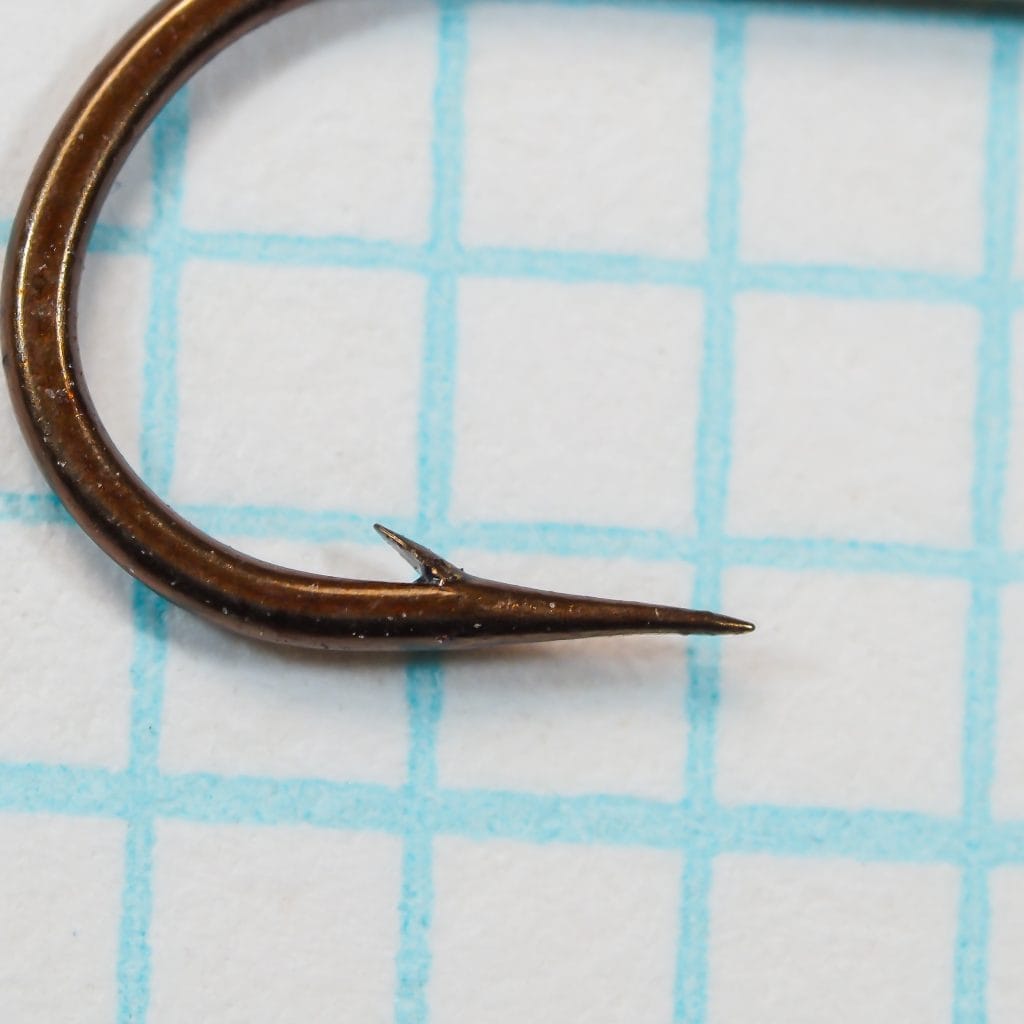 S. Allcock W173 Model Perfect — hook point detail showing superior point geometry and bronzed finish — size 8 — on measurement grid