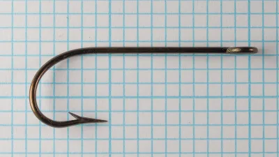 Mustad 3136 — full hook profile showing Kirby bend — size 4/0 — bronzed finish