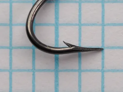 Mustad 4370 Size 6 Hook — side profile showing Kirby offset point, ringed eye, and extra-long shank — bright steel finish on measurement grid