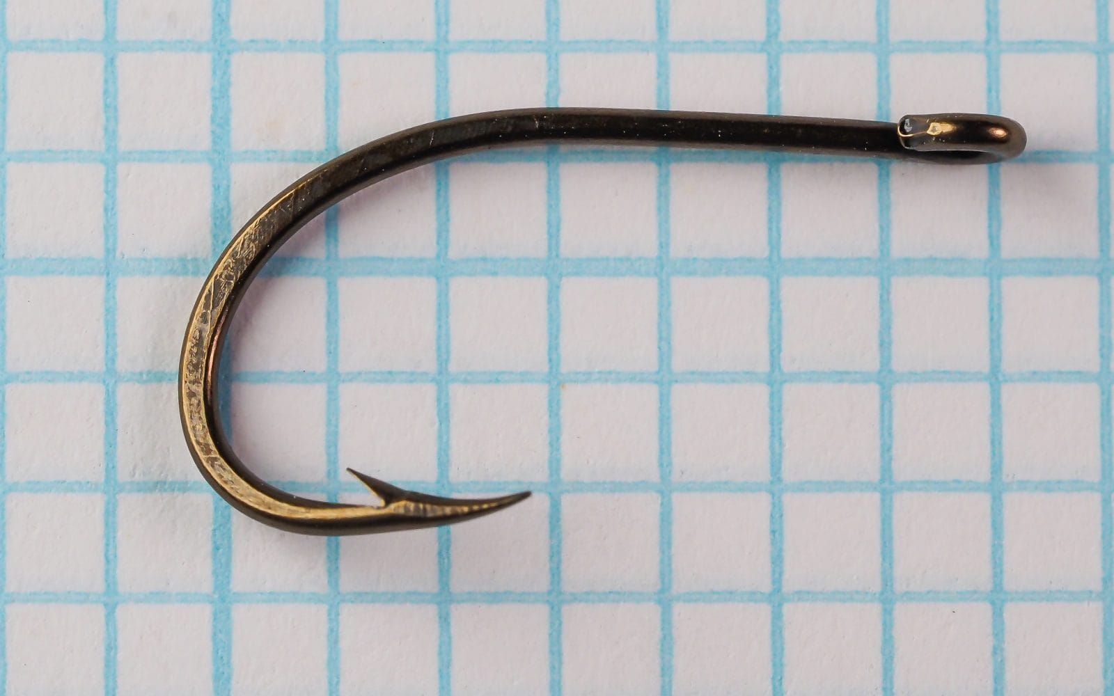 Mustad 530B hook — full hook profile including eye and shank — size 3 — reversed eye position and forged wire construction visible