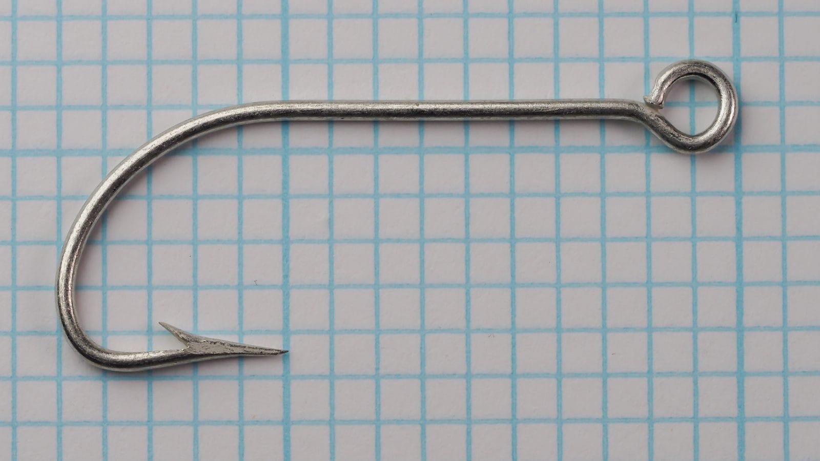 Mustad 7107 A tinned Limerick hook — full hook profile including eye and bend — size 3/0 — shows overall proportions on measurement grid.