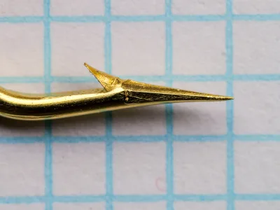 Mustad 91753 hook point — size 1/0 — superior point geometry — lateral view showing sharp tip and minimal barb