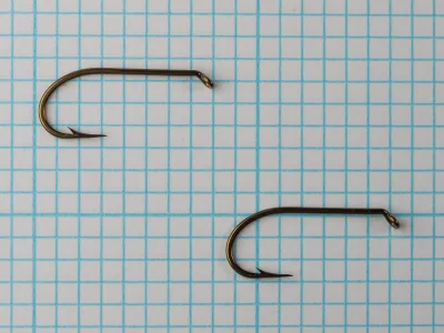 Mustad 94836 Viking Hooks — two specimens showing eye detail and consistency — size 6 — on measurement grid