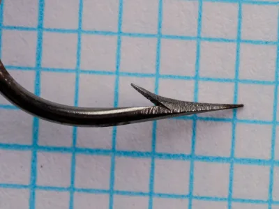 Milward 2310 R Hook — point profile on grid — size 16 — spear point and polished steel finish