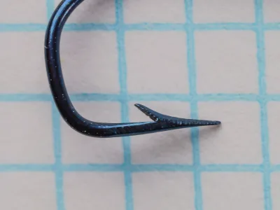 Milward Quality 2639 R hook — profile showing point taper and barb geometry — size 8 — blued finish with hollow point