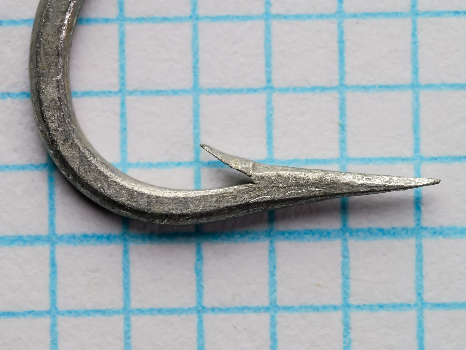 Mustad 34002 O'Shaughnessy Hook — profile view showing point geometry and barb — size 2/0 — cadmium-tinned finish