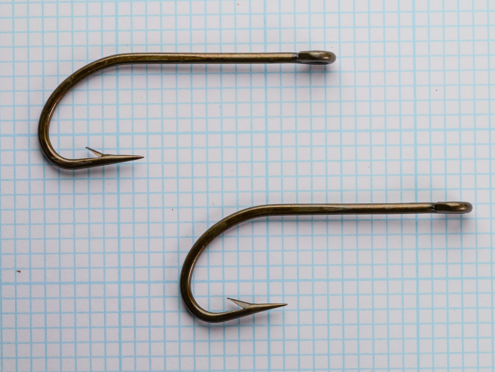 Horrocks-Ibbotson No. 169 O'Shaughnessy — two hooks at different angles to show bend symmetry and ring eye detail — size 5/0 — bronzed forged construction
