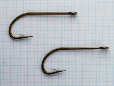 Horrocks-Ibbotson No. 169 O'Shaughnessy — two hooks at different angles to show bend symmetry and ring eye detail — size 5/0 — bronzed forged construction