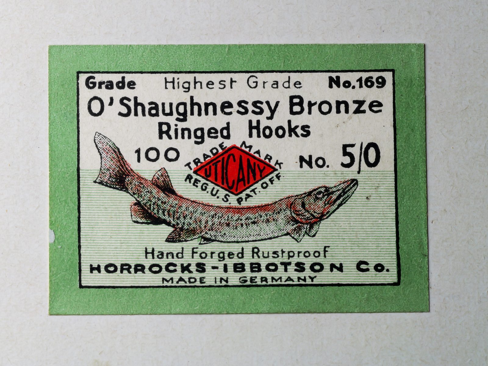 Horrocks-Ibbotson No. 169 O'Shaughnessy — green box label with black letterpress printing, product description, fish illustration, and red Horrocks-Ibbotson trademark — size 5/0 — Made in Germany notation