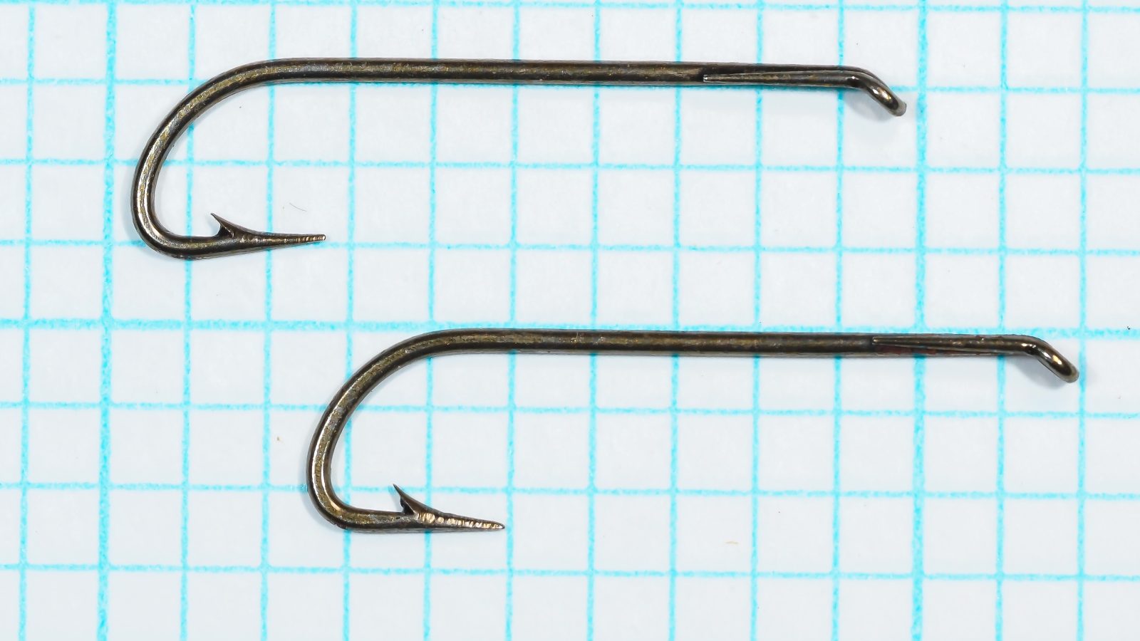 Alfred Willis and Sons Pennell Hooks — Two specimens showing eye profile and overall bend geometry — Size 10 — Turned-down tapered eye with Limerick bend