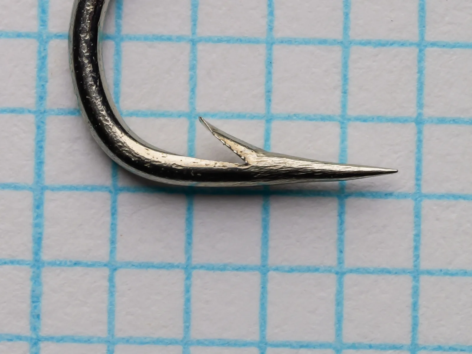 Allcocks S217 Sproat — point detail showing superior geometry and barb placement — size No. 2 — polished steel finish