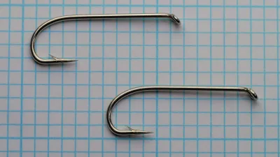 Allcocks S222 Sproat Hook — two specimens shown together for size and form comparison — size 6 — nickelled finish on measurement grid