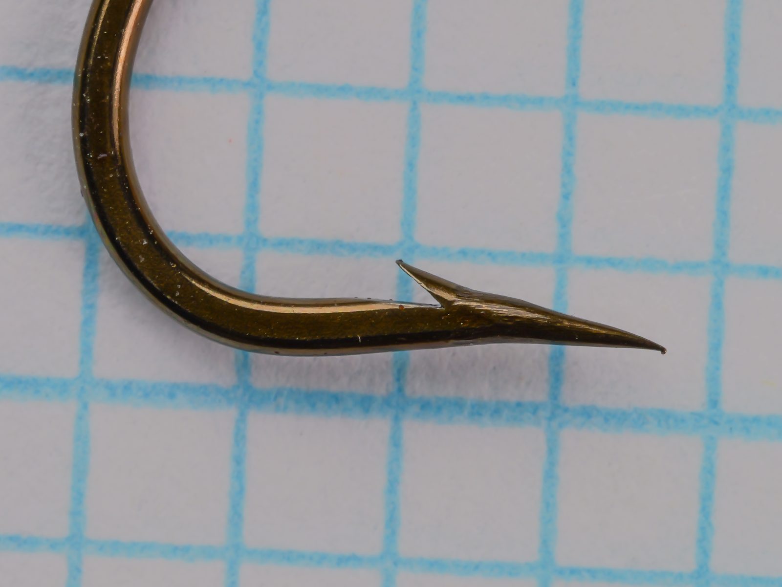 Joe Roope Jr. Longshank — close-up side profile showing point, barb, and bend geometry — size 4 — bronzed detail