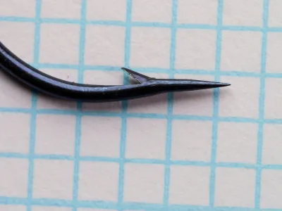 Milward 2627 R Hook — point detail at higher magnification — size 1/0 — showing barb and taper