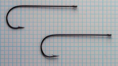 Milward 2627 R Hooks — two specimens showing consistency of manufacture — size 1/0 — blued finish