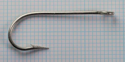 Mustad 3138 hook — full profile showing Kirby bend — size 9/0 — tinned finish on measurement grid