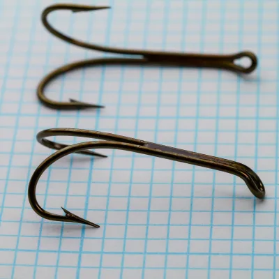 Mustad 3573 Double Fly Hook — top and bottom view showing both point sections and turned-down ball eye — size 4 — bronzed finish