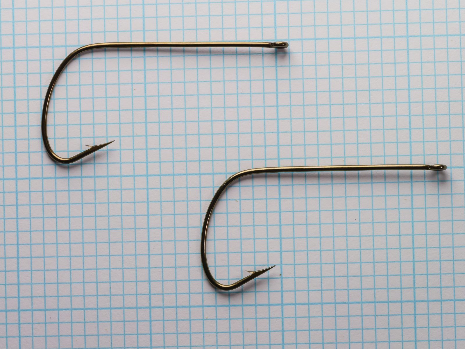 Mustad 37187 Stinger Hook — Two hooks side-by-side on measurement grid — size 1/0 — comparing bend geometry and gape width