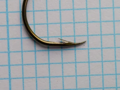 Mustad 37360 Aberdeen — point and barb detail — size 3/0 — curved-in point geometry