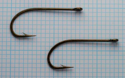 Mustad 3811 O'Shaughnessy Hooks — multiple specimens showing size and comparison — size 3/0 — demonstrating hook quality and consistency