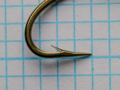 Mustad 3831 hook point detail — hollow point geometry — size 4 — bronzed finish