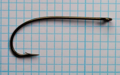 Mustad 3891 Sproat Hook — profile view showing full bend geometry and ringed eye — size No. 1 — hollow point and rustproof finish