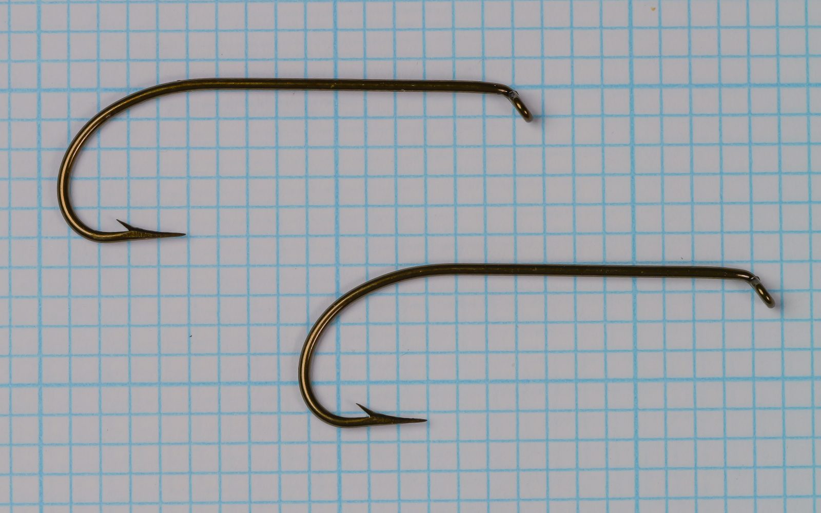 Mustad 3906B size No. 1 — pair of hooks from original card — side-by-side comparison — showing consistency and symmetry — on measurement grid