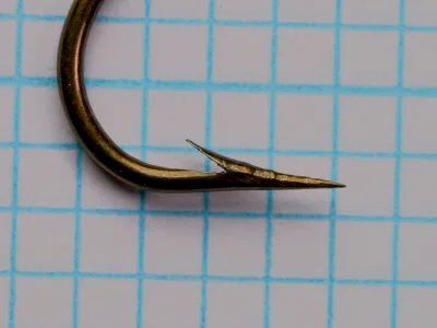 Mustad 3908 A — close-up of hook point — size 2 — concave hollow point geometry visible