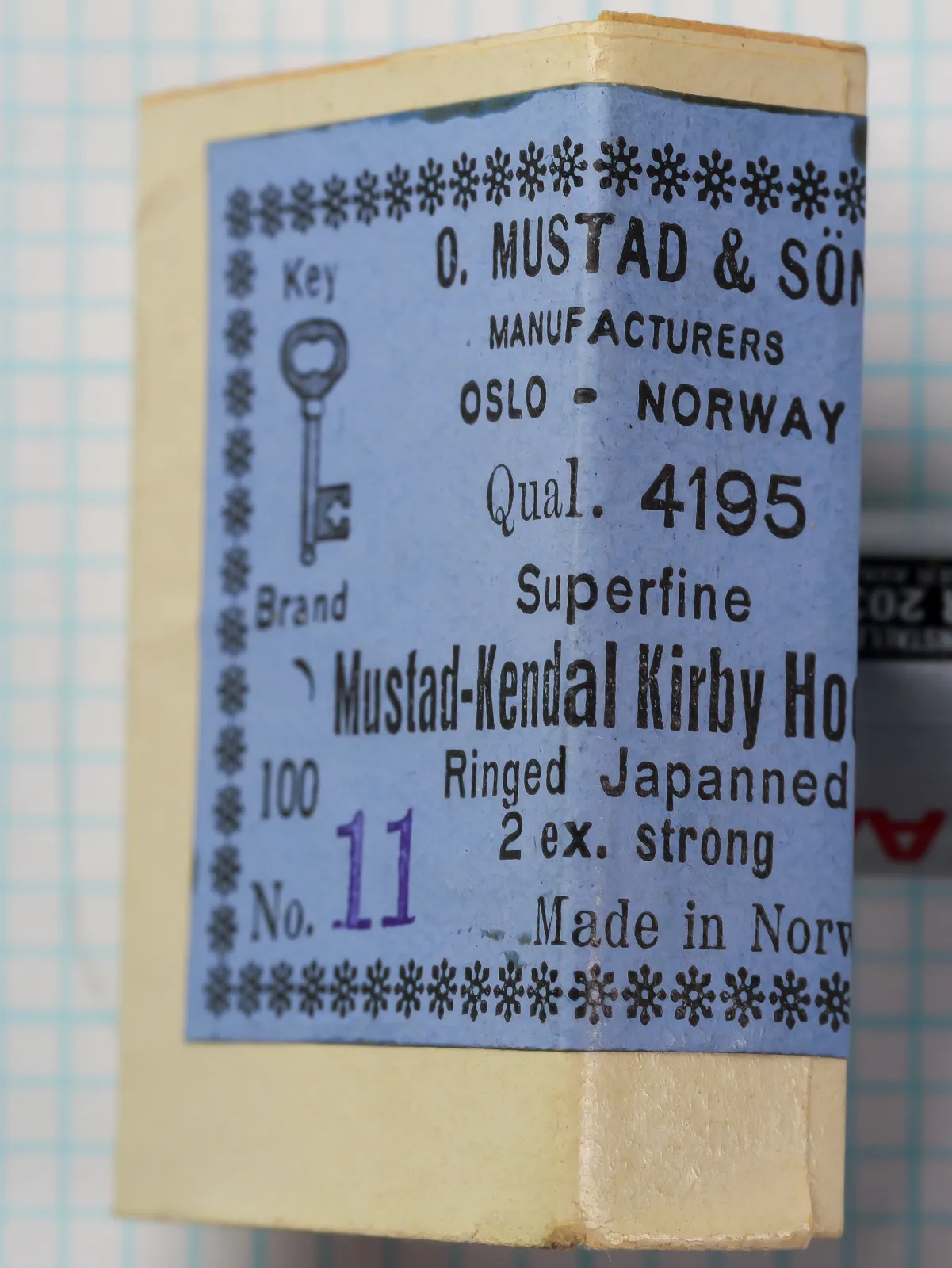 Mustad 4195 Kendal Kirby — original packaging and sales card label — size No. 11 — blue label with Key Brand logo and Oslo–Norway designation, c. 1950s–60s