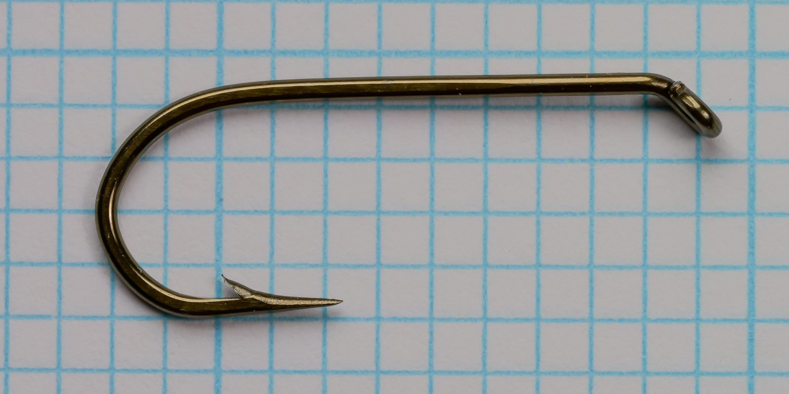 Mustad 7957 BX — full hook profile showing tapered down eye, forged shank, and sproat bend — bronzed — size No. 2