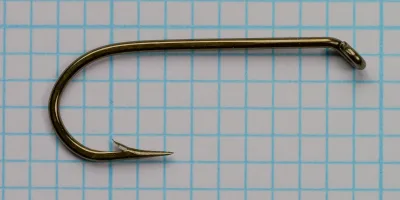 Mustad 7957 BX — full hook profile showing tapered down eye, forged shank, and sproat bend — bronzed — size No. 2