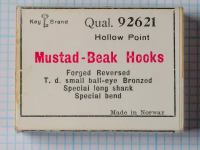 Mustad 92621 Key Brand packaging — sales card showing Beak Hook specifications in black and red letterpress type — front label with skeleton key logo