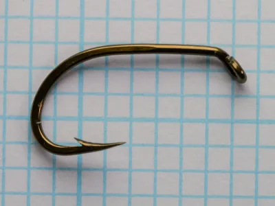 Mustad 9557 Hook — full hook profile showing bend and eye — size No. 4 — overhead view on measurement grid
