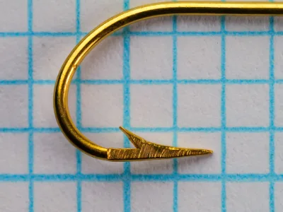 Pflueger Carlisle hook size 6 — side profile showing bend depth and point geometry — gold plated finish
